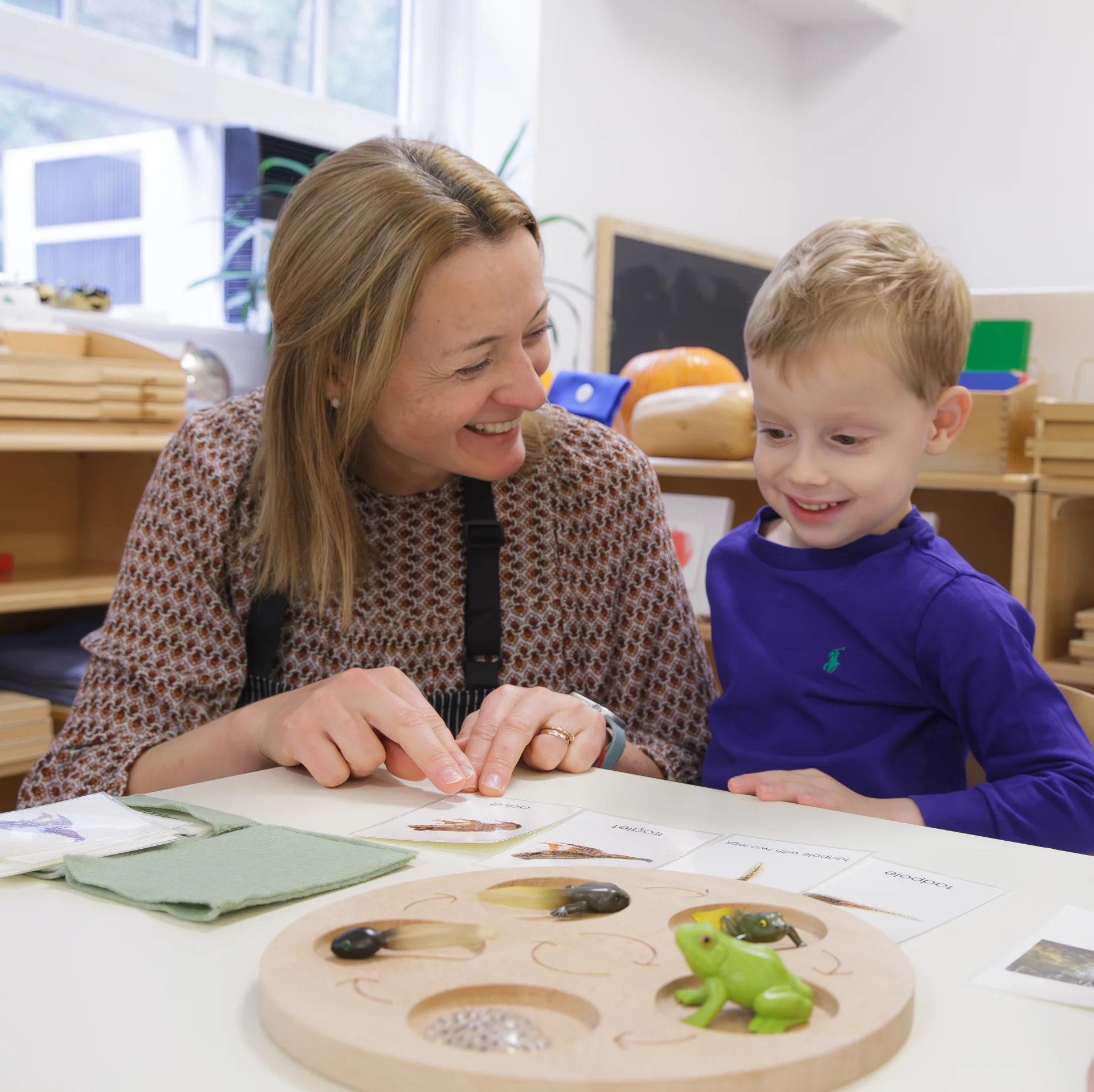 teacher and student practicing letters